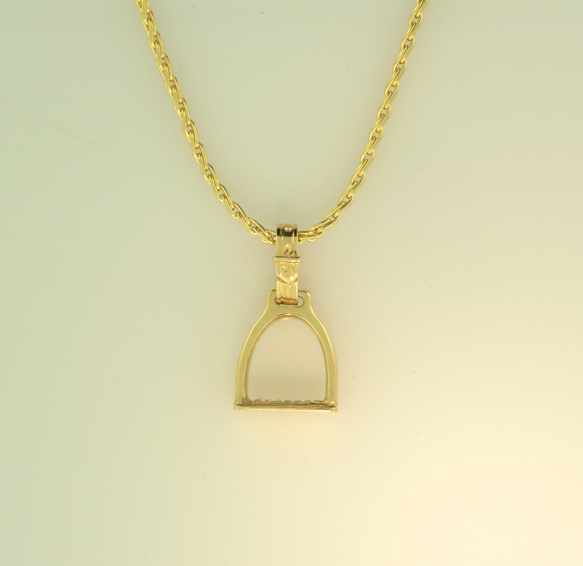 14KT yellow gold large stirrup pendant on 14KT yellow gold chain