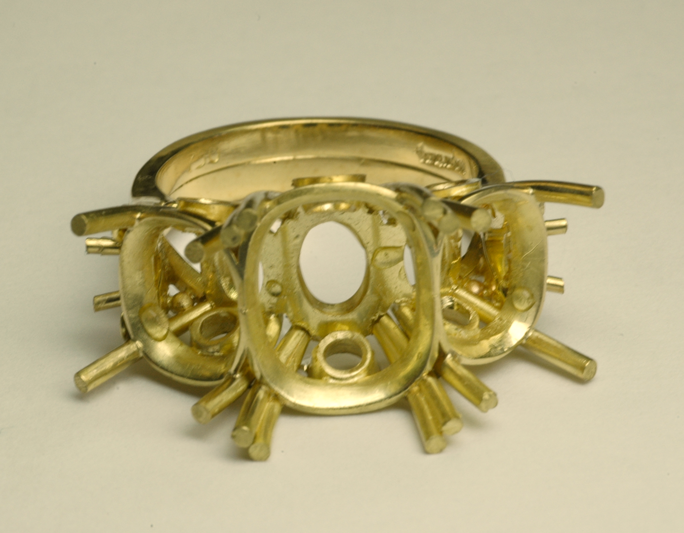 Three Stone RIng in 18KT Yellow Gold before Setting Copyrighted Original by Thomas Michaels Designers, Inc. Three stone ring in 18KT yellow gold before setting