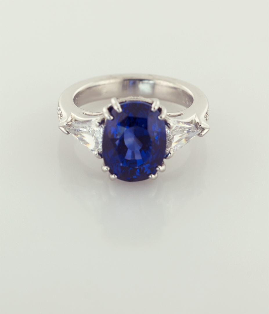 Oval Sapphire 3.50ct. and Trilliam Shape Diamonds Platinum Ring