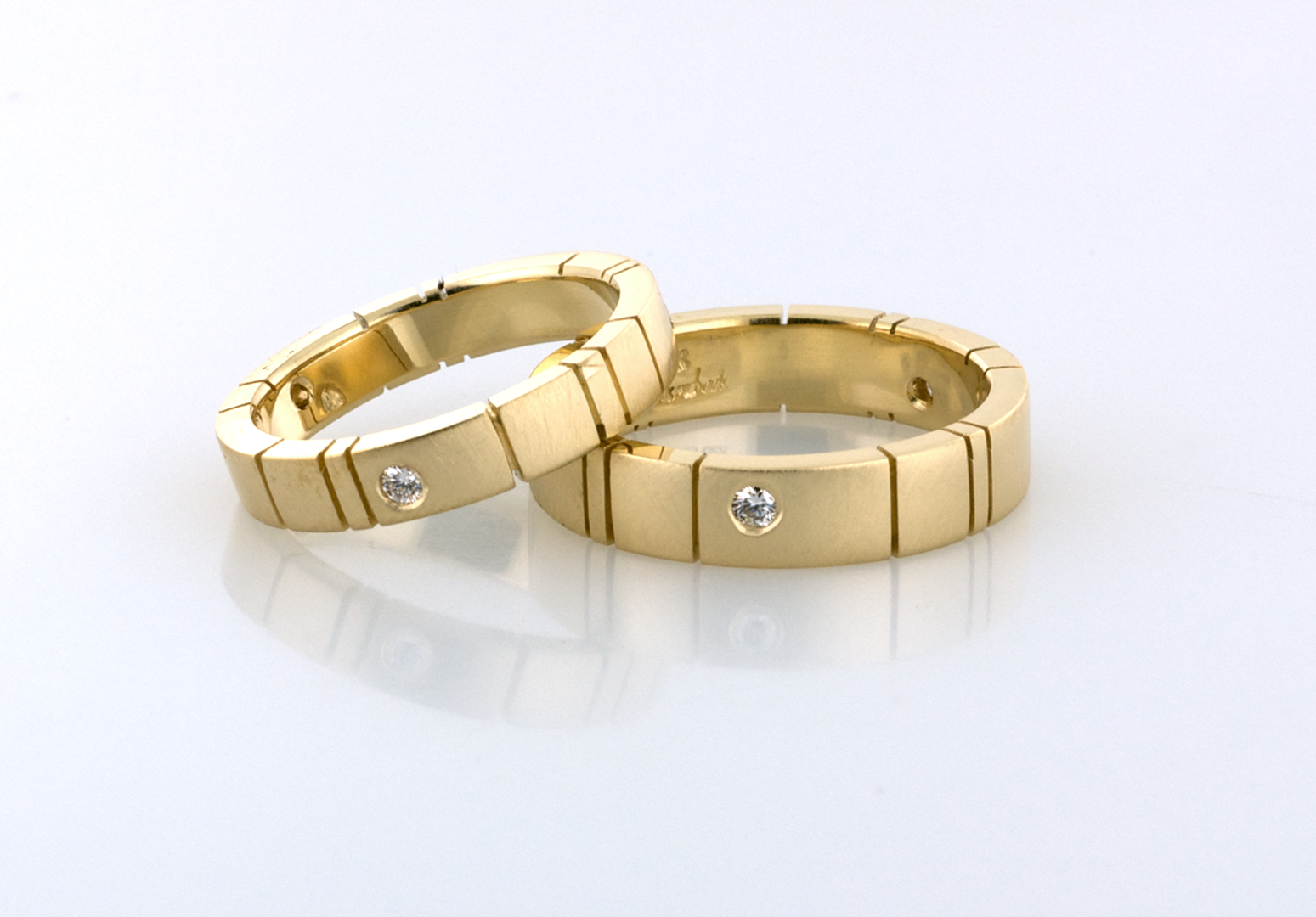 gold wedding bands set with diamonds Copyrighted Original by Thomas Michaels 