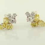 White and yellow diamond cluster earrings.