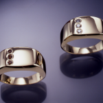 14KT yellow gold gents rings set each set with .15ct. diamonds