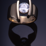 18KT gold and round diamond (1.50ct.) contemporary ring set with 1.50ct.