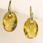 Oval Citrine Earring in 18KT yellow gold with yellow sapphire accents.