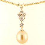 South Sea Baroque, Golden South pearl Pendant in 14KT yellow gold with .40ct. diamond accents on a 14KT yellow gold wheat chain