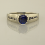 Contemporary Sapphire Solitaire with accent diamonds