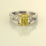 Platinum, 18KTyellow, natural fancy yellow radiant cut diamond, trillian sides