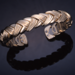 14KT yellow gold flexible braided chevron cuff bracelet , titanium inner spring 