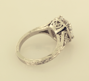 Antique style platinum diamond solitaire with hand engraving , back view