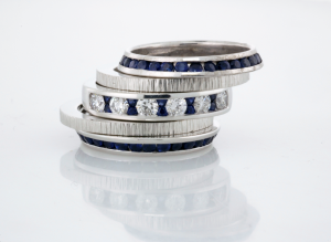 Diamond and Sapphire ring with two textured 18KT white gold bands and two sapphire beveled eternity bands
