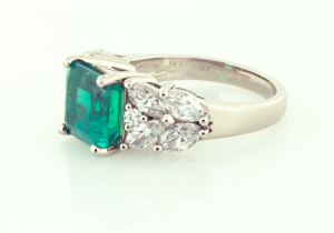 Emerald and diamond ring set in platinum and 18KT yellow gold.