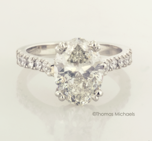 3.00ct. oval cut diaond solitaire with diamond accents, copyrighted original from Thomas Michaels Designers, Inc.