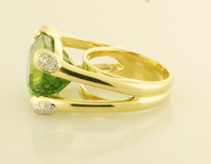 28ct. cushion cut peridot ring with diamond pavé accents side view