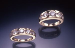 Diamond and gold rings with round and princess cut diamonds