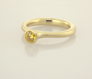 Natural Fancy Vivid Yellow .33ct. DIamond set in 22KT Yellow Gold Solitaire. 