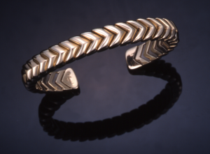 14KT yellow gold flexible chevron cuff bracelet , titanium inner spring 